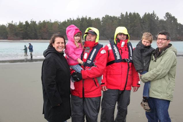 Photo caption: Peter Deefholts (far right) was rescued by Coastguard Waimakariri-Ashley volunteers after being washed out to sea while he was fishing at the Waimakariri-Ashley river mouth in January 2010. Peter is pictured with his family, Coastguard Unit President Dave Johnson (left) and Coastguard volunteer Noel Pope. 